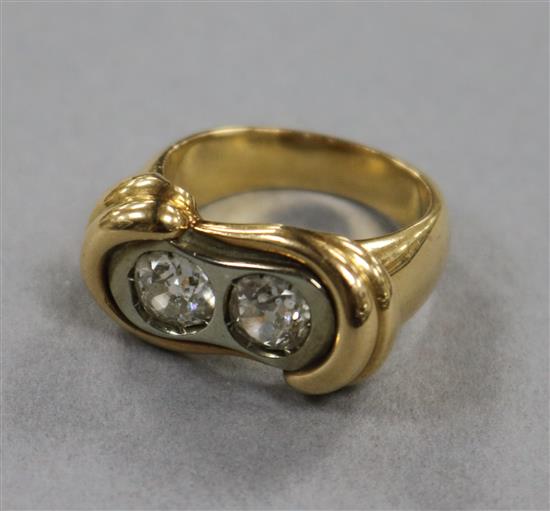 A heavy gold and diamond dress ring, set two brilliant cut stones, each approximately 0.75cts, size P, gross 17.3 grams